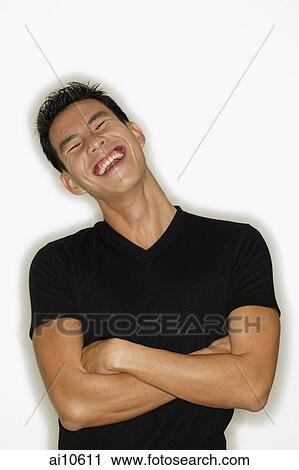 Young man smiling, arms crossed. View Large Photo Image Stock Image - Young man smiling, arms crossed.. Fotosearch