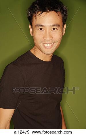 Young man smiling, looking at camera View Large Photo Image Stock Photo - Young man smiling, looking at camera. Fotosearch