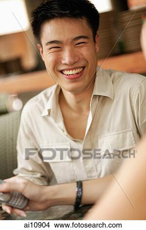 Picture - Young man smiling, portrait. Fotosearch