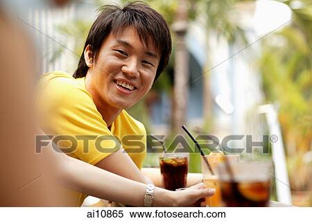 Young man smiling, portrait View Large Photo Image Stock Photography - Young man smiling, portrait. Fotosearch