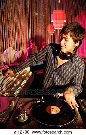 Young man spinning at club View Large Photo Image Stock Image - Young man spinning at club. Fotosearch