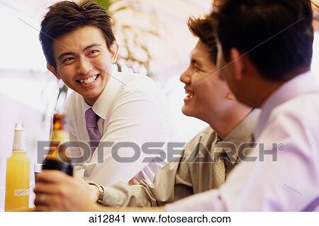 Young men having drinks View Large Photo Image Stock Image - Young men having drinks. Fotosearch