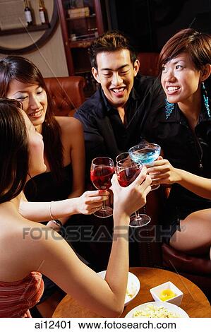 Young people toasting with drinks View Large Photo Image Stock Image - Young people toasting with drinks. Fotosearch