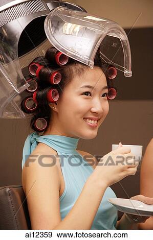Young woman at beauty salon, drinking tea View Large Photo Image Stock Photo - Young woman at beauty salon, drinking tea. Fotosearch