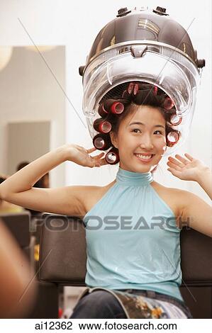 Young woman at beauty salon, hands raised View Large Photo Image Stock Image - Young woman at beauty salon, hands raised. Fotosearch