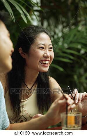 Young woman at cafe, smiling. View Large Photo Image Stock Image - Young woman at cafe, smiling.. Fotosearch