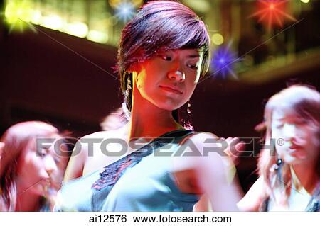 Young woman at night club View Large Photo Image Stock Photograph - Young woman at night club. Fotosearch