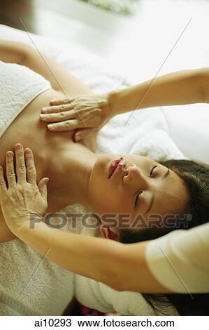 Young woman being massaged View Large Photo Image Stock Image - Young woman being massaged. Fotosearch