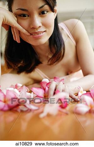 Young woman, hands on head, looking at camera View Large Photo Image Stock Photo - Young woman, hands on head, looking at camera. Fotosearch