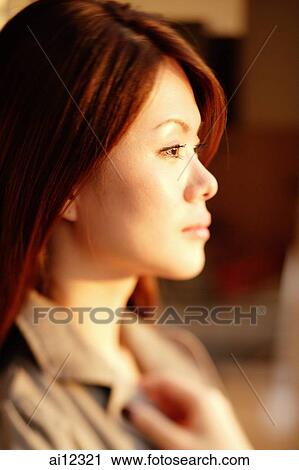 Young woman in profile, portrait View Large Photo Image Stock Image - Young woman in profile, portrait. Fotosearch