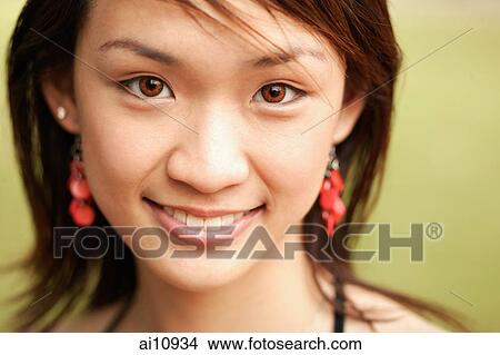 Young woman, looking at camera, portrait View Large Photo Image Picture - Young woman, looking at camera, portrait. Fotosearch