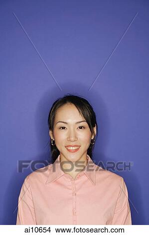 Young woman, looking at camera, smiling View Large Photo Image Picture - Young woman, looking at camera, smiling. Fotosearch