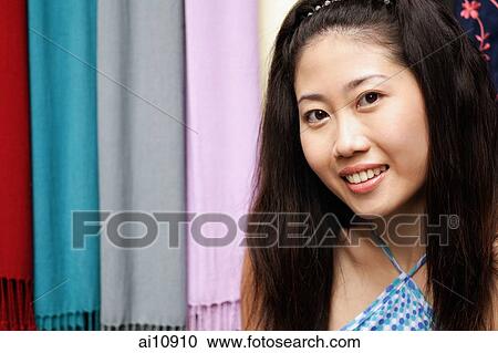 Young woman looking at camera View Large Photo Image Stock Image - Young woman looking at camera. Fotosearch