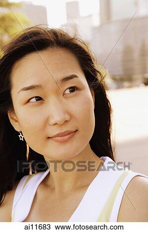 Young woman looking away, portrait View Large Photo Image Stock Image - Young woman looking away, portrait. Fotosearch