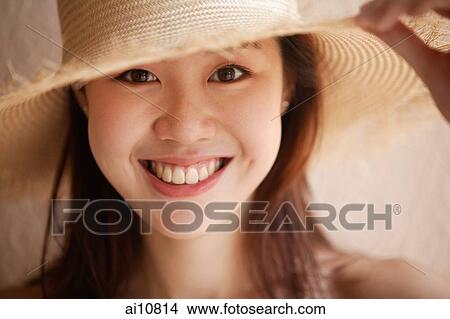 Young woman looking away, wearing hat View Large Photo Image Picture - Young woman looking away, wearing hat. Fotosearch