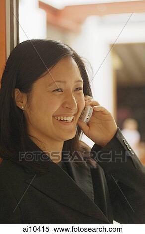 Young woman on mobile phone View Large Photo Image Stock Photography - Young woman on mobile phone. Fotosearch