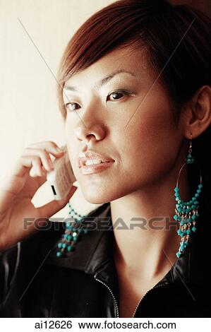 Young woman on the phone View Large Photo Image Stock Photograph - Young woman on the phone. Fotosearch