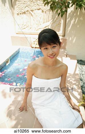 Young woman sitting by outdoor bath View Large Photo Image Stock Photography - Young woman sitting by outdoor bath. Fotosearch