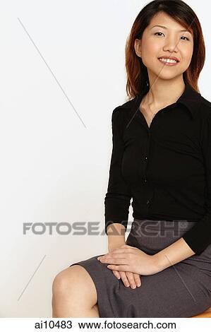 Young woman sitting, hands together. View Large Photo Image Stock Image - Young woman sitting, hands together.. Fotosearch