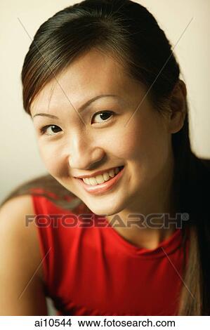 Young woman smiling, portrait View Large Photo Image Picture - Young woman smiling, portrait. Fotosearch