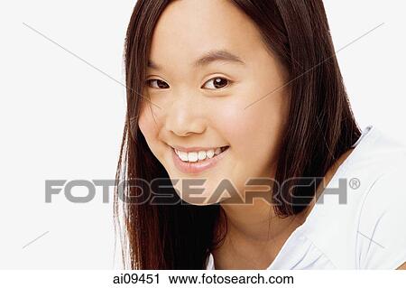 Young woman smiling, portrait View Large Photo Image Stock Image - Young woman smiling, portrait. Fotosearch
