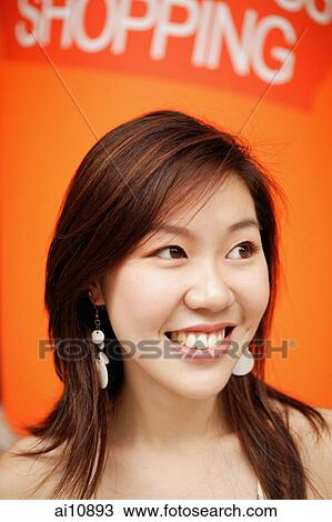 Young woman smiling, portrait View Large Photo Image Stock Image - Young woman smiling, portrait. Fotosearch