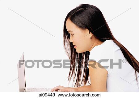 Young woman using laptop. View Large Photo Image Stock Photo - Young woman using laptop.. Fotosearch