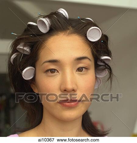 Young woman with curlers in hair, portrait View Large Photo Image Stock Photo - Young woman with curlers in hair, portrait. Fotosearch