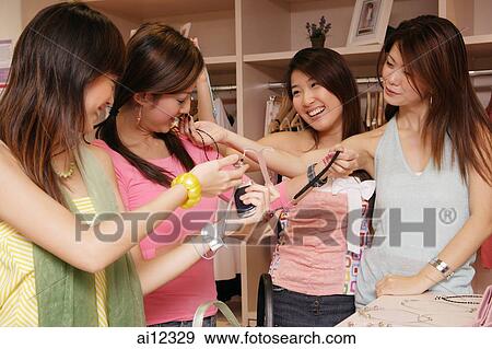 Young women shopping View Large Photo Image Stock Photo - Young women shopping. Fotosearch
