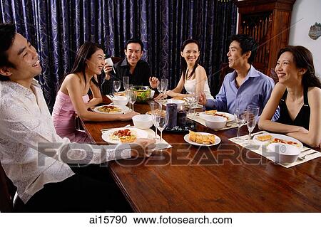 Adults at a dinner party, sitting around table View Large Photo Image Stock Image - Adults at a dinner party, sitting around table. Fotosearch