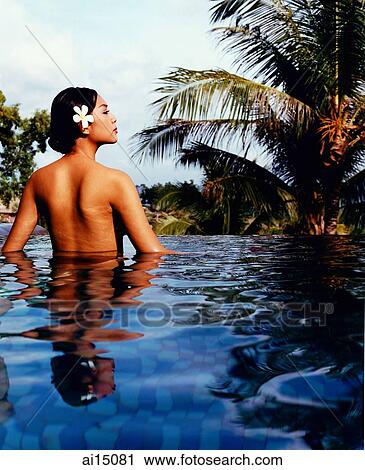 Asian female relaxing in pool View Large Photo Image Stock Image - Asian female relaxing in pool. Fotosearch