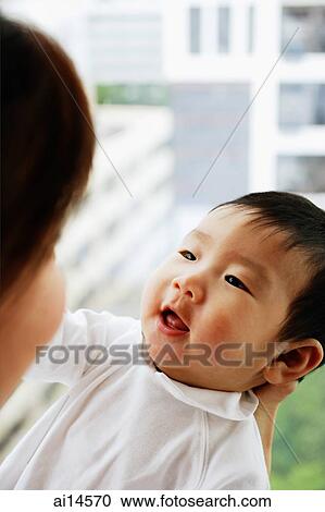 Baby boy looking at mother View Large Photo Image Stock Image - Baby boy looking at mother. Fotosearch