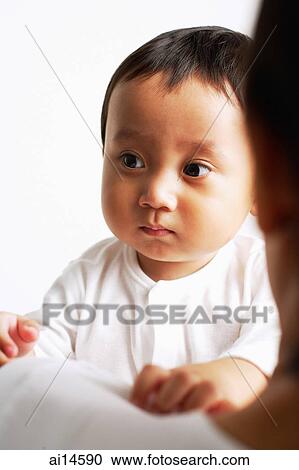 Baby boy looking away, over the shoulder view View Large Photo Image Stock Image - Baby boy looking away, over the shoulder view. Fotosearch