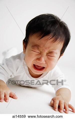Baby boy lying on front, crying View Large Photo Image Stock Photo - Baby boy lying on front, crying. Fotosearch