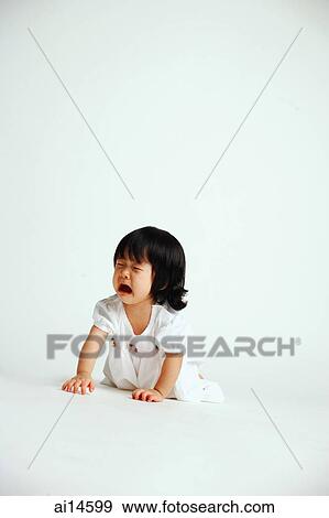 Baby girl crawling on floor, crying View Large Photo Image Stock Photo - Baby girl crawling on floor, crying. Fotosearch