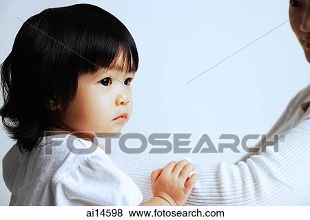Baby girl looking away View Large Photo Image Stock Photo - Baby girl looking away. Fotosearch