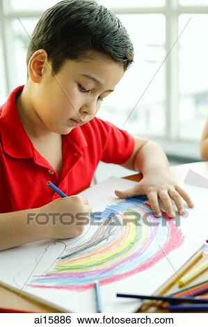 Boy holding colour pencil, drawing View Large Photo Image Stock Photograph - Boy holding colour pencil, drawing. Fotosearch