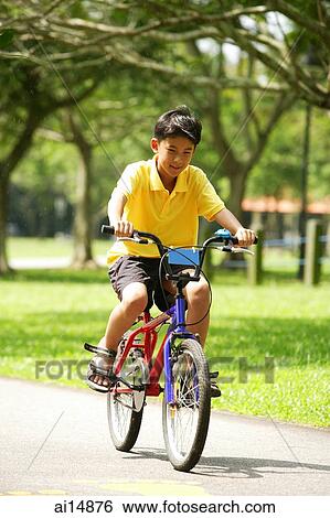 Boy on bicycle View Large Photo Image Stock Photograph - Boy on bicycle. Fotosearch