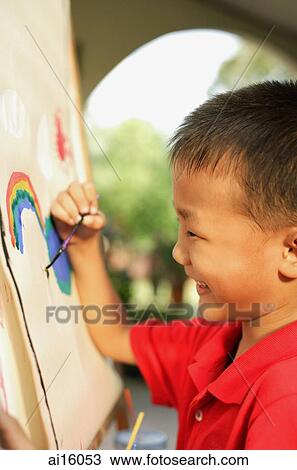 Boy painting, side view View Large Photo Image Stock Image - Boy painting, side view. Fotosearch