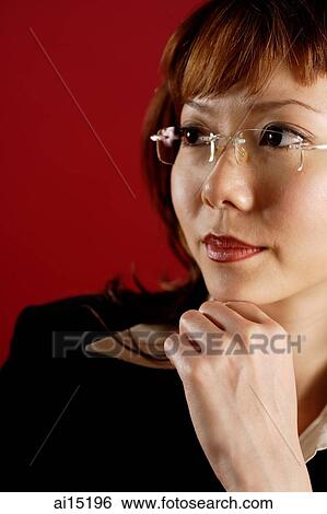 Business woman, hand on chin, looking away View Large Photo Image Stock Photograph - Business woman, hand on chin, looking away. Fotosearch