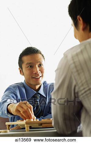 Businessmen playing chess View Large Photo Image Stock Photo - Businessmen playing chess. Fotosearch