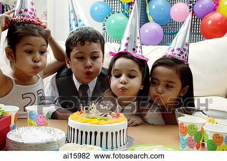 Children celebrating birthday, blowing candles on cake View Large Photo Image Stock Image - Children celebrating birthday, blowing candles on cake. Fotosearch