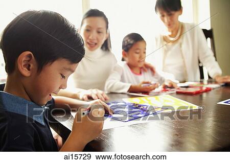 Children drawing, mother and grandmother watching View Large Photo Image Stock Photo - Children drawing, mother and grandmother watching. Fotosearch