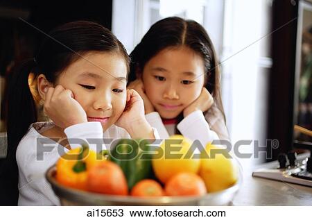 Children staring at a bowl of vegetables View Large Photo Image Stock Image - Children staring at a bowl of vegetables. Fotosearch
