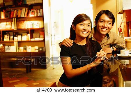 Couple at bar counter, looking at camera, portrait View Large Photo Image Stock Image - Couple at bar counter, looking at camera, portrait. Fotosearch
