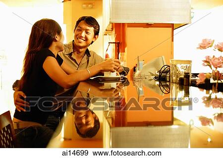 Couple at bar counter View Large Photo Image Stock Photo - Couple at bar counter. Fotosearch