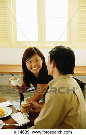 Couple at cafe, talking View Large Photo Image Stock Photo - Couple at cafe, talking. Fotosearch