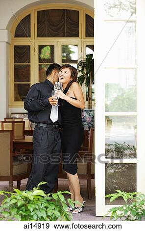 Couple at doorway, woman laughing View Large Photo Image Stock Photo - Couple at doorway, woman laughing. Fotosearch