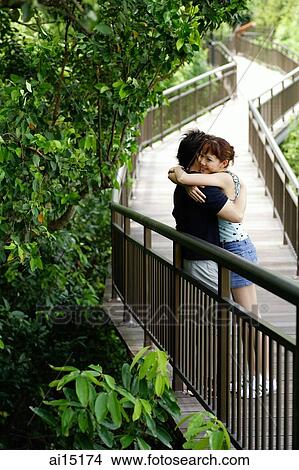 Couple embracing in park View Large Photo Image Picture - Couple embracing in park. Fotosearch