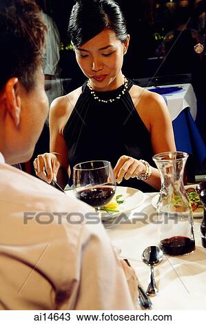 Couple having dinner, over the shoulder view View Large Photo Image Stock Image - Couple having dinner, over the shoulder view. Fotosearch